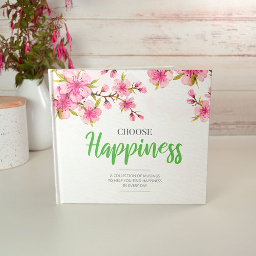 Choose Happiness book  with pretty flowers in background